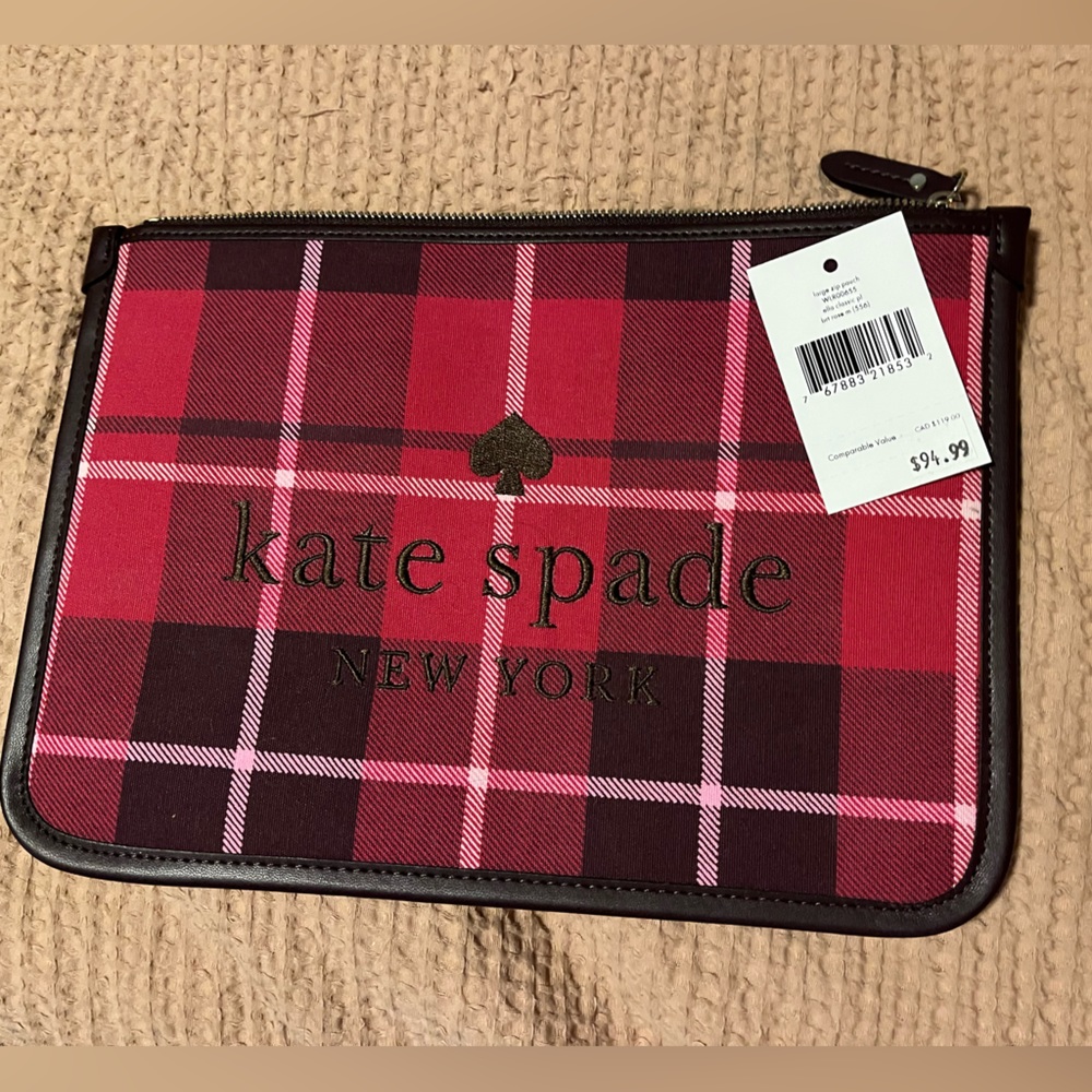 Never used still have tags. Kate Spade Envelope clutch